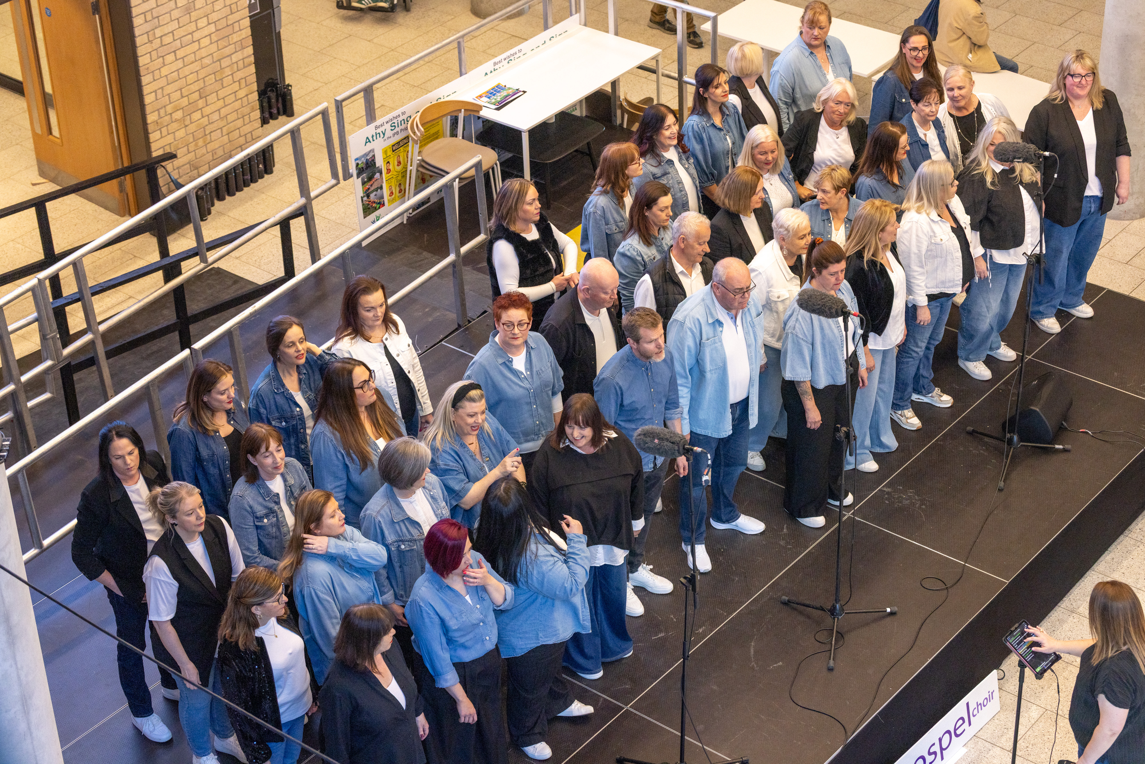 Group on stage singing.